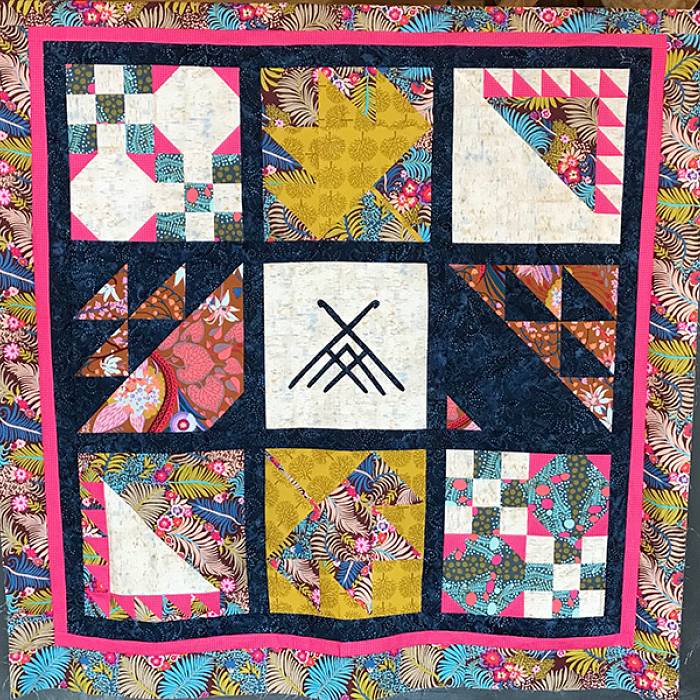 Teaser image for Quilting the North Woods: A Seasonal Block of the Month Quilt